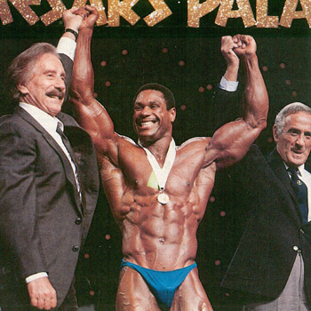 Joe and Ben Weider raise Mike Christians arms in victory
