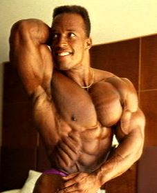 Shawn Ray flexing impressive abs
