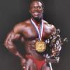 Lee Haney with Mr. Olympia medal and trophy.